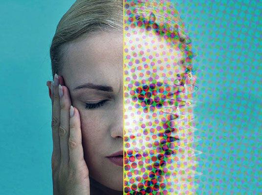 Woman Suffering from a Migraine